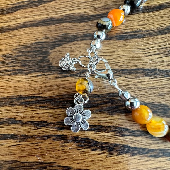 Handcrafted bracelet made with bumblebee agate and sterling silver charms. - Picture 2 of 4